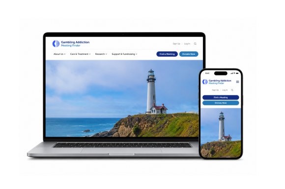 The new homepage shown on a laptop and phone, with a lighthouse on the rocky coast